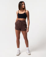Women’s lightweight dark brown sweat shorts with a flattering high-waisted fit and tonal drawstring for size customization.