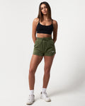 Green Women’s Balance shorts with ultra-plush material, elastic waistband, and a modern high-waisted design.