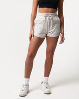 Front view of women’s Balance Shorts in light grey, highlighting side pockets, high-waisted fit, and ultra-soft fabric.