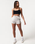 Front-facing view of women’s Balance Shorts in light grey with a soft cotton-polyester blend and side pockets for convenience.
