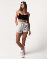Lightweight light grey women’s shorts with a high-waisted elasticized waistband and shape-retaining design.