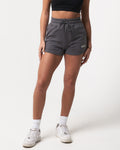 Lightweight dark grey women’s shorts with a high-waisted elasticized waistband and shape-retaining design.