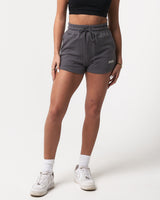 Lightweight dark grey women’s shorts with a high-waisted elasticized waistband and shape-retaining design.