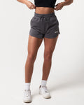 Stylish dark grey women’s shorts with ultra-plush material, elastic waistband, and a modern high-waisted design.