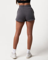 Women’s dark grey Balance Shorts shown from the back, highlighting durable shape-retaining fabric and modern design.