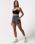 Women’s Balance Shorts in dark grey, highlighting side pockets, high-waisted fit, and ultra-soft fabric.
