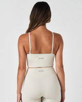 Back view of the Force Tank in white with reflective LYFTLYFE logo and racerback strap design.