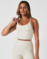 Left side view of women’s Force Tank in Vapor White, highlighting the fitted silhouette and skinny strap detail.