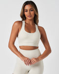 Women’s Force sports bra in cream white, designed with sculpting fabric and a second-skin feel.