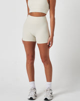 Left side view of LYFTLYFE Force 4'' shorts in vapor white, featuring a high-rise waistband and sculpting fit.