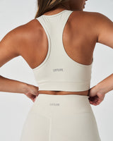 Close-up of LYFTLYFE logo on back waistband of Force 6.5" biker shorts in vapor white.