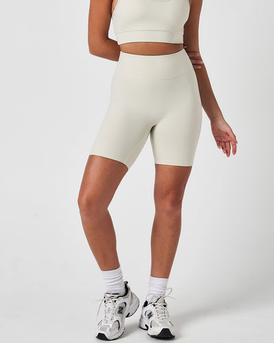 Front view of women’s Force 6.5" biker shorts in vapor white, featuring a seamless waistband and sculpting fit.
