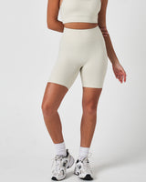 Front view of women’s Force 6.5" biker shorts in vapor white, featuring a seamless waistband and sculpting fit.