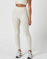 Left side view of women’s Force Leggings in Vapor White, featuring high-waisted sculpting fit and buttery-soft finish.