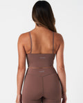 Rear profile of women’s Force Tank in brown, featuring center-back reflective branding.