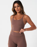 Left angle of Force Tank in brown with sculpted compression fit and second-skin stretch fabric.