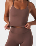 Detailed view of women’s brown Force Tank front, highlighting the compressive shape and smooth texture.
