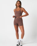 Athletic outfit featuring brown Force Tank and 4'' shorts, built for performance and sculpted silhouette.