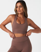 Front view of LYFTLYFE Force Bra in brown, showcasing minimal seams and compression fabric.