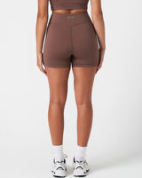 Rear shot of brown LYFTLYFE 4'' shorts with high-rise waist and squat-proof coverage.