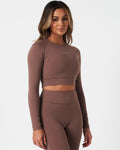 Right side view of Force Long Sleeve Crop in brown, showing sculpting fit and seamless construction.