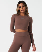 Front-facing view of Force Crop in brown, designed for flexibility and anti-odor performance.