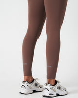 Close-up of back leg hem featuring LYFTLYFE logos, showcasing minimal branding.