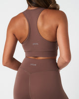 High-rise sculpting shorts in brown shown from the back, built for mobility and support.
