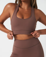 Close up of the front of LYFTLYFE Force Bra in brown, showcasing minimal seams and compression fabric.