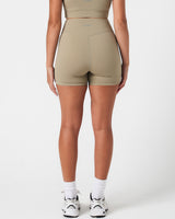 Rear shot of light green LYFTLYFE 4'' shorts with high-rise waist and squat-proof coverage.