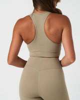 Close-up of back waistband on LYFTLYFE Force 4'' shorts in light green with reflective LYFTLYFE logo detail.