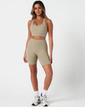 Full body outfit view of the Force Bra and matching high-waisted shorts in light green.