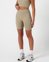 Light green Force shorts from the left side, showcasing the contoured shape and smooth finish.