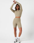 Complete activewear outfit showing the Force Long Sleeve Crop with 4-way stretch shorts in a coordinated neutral tone.