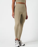 Right side view of women’s leggings with 4-way stretch and second-skin comfort in light green.