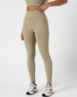 Left side view of women’s leggings with 4-way stretch and second-skin comfort in light green.