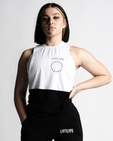 Women’s two-panel sleeveless shirt, white on top and black on the bottom, with anti-odor performance fabric, and Lyftlyfe logo on the chest.