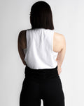 Back view of Women’s two-panel sleeveless shirt, white on top and black on the bottom.