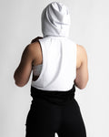Back view of Women’s athletic sleeveless hoodie, white on top and black on the bottom, made with tri-blend fabric for performance. 
