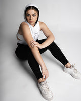 Women’s athletic sleeveless hoodie, in black and white, made with tri-blend fabric for performance. 