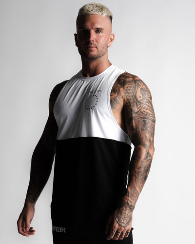 Mens tank top designed in a two panel - white at the top and black on the bottom panel. 