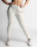 LYFTLYFE women’s joggers in light grey, shown from the front with athletic fit.