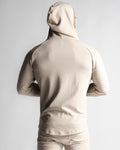 Men's athletic hoodie in sand color, back profile highlighting muscle-contour fit.
