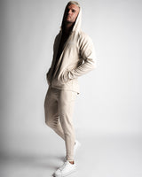 Full-body outfit with Function hoodie unzipped, paired with matching joggers in beige. 
