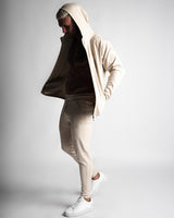 Full-body outfit with Function hoodie unzipped, paired with matching Function joggers in beige. 