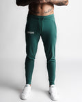 Front angle of athletic dark green joggers with minimalist design and logo.