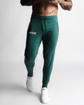 Men’s Function joggers in dark green with relaxed fit and front LYFTLYFE branding. 