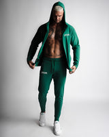 Full-body outfit with Function hoodie unzipped, paired with matching Function joggers in green. 