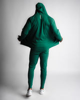 Full-body outfit back view with Function hoodie and matching Function joggers in green. 