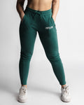 Full front view of LYFTLYFE React joggers in green with high-waist fit and LYFTLYFE log. 